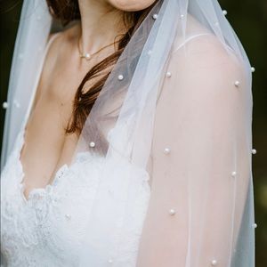 Like-new, floor length ivory veil with pearls and comb attachment